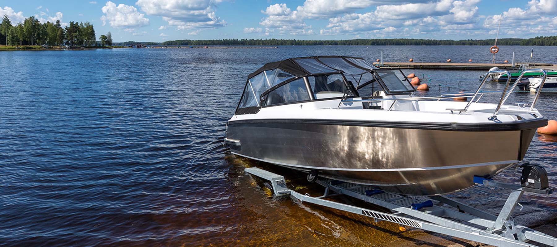 small motorboat being launched into water